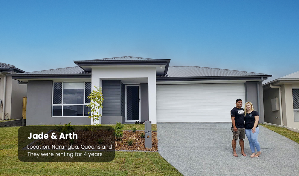 Couple-Stand-In-Front-New-Home